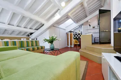 a living room with a couch and a table at Monti Charme - My Extra Home in Rome