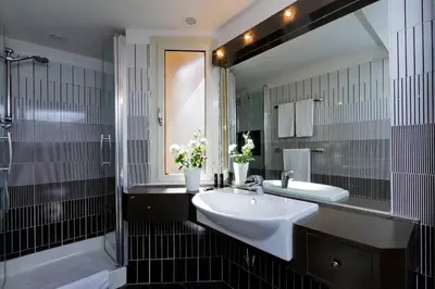 a bathroom with a sink and a mirror and a tub at Monti Charme - My Extra Home in Rome