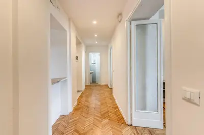 an empty hallway with a glass door in a apartment at V E N E R E Apartments in Rome