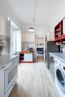 a large kitchen with a washer and dryer at Quiet ApartmentTrastevere in Rome
