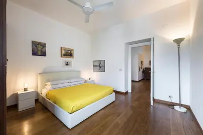 a bedroom with a bed and a ceiling fan at Quiet ApartmentTrastevere in Rome
