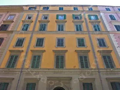 a yellow building with lots of windows at Aenea's B&B in Rome