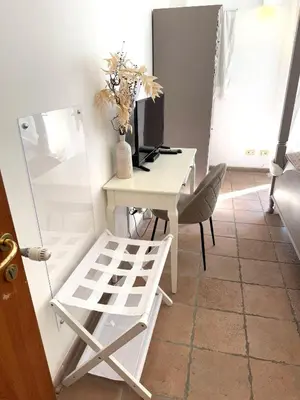 a desk and a chair in a room at Aenea's B&B in Rome