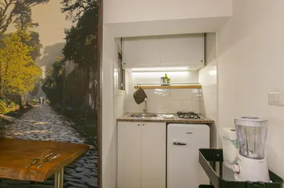 a small kitchen with a counter and a blender at Trevi Little Palace #3 in Rome