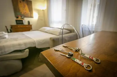 a hospital room with two pairs of nursing instruments on a table at Trevi Little Palace #3 in Rome