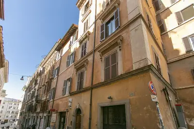 an old building on a street in a city at Trevi Little Palace #3 in Rome