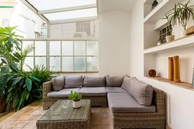 a living room with a couch and a table at Trastevere Lovely Apartment in Rome