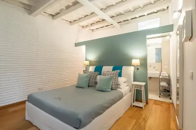 a bedroom with a large bed in a room at Trastevere Lovely Apartment in Rome