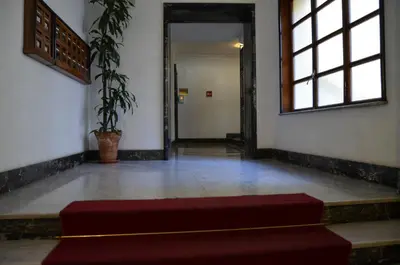 a hallway with a red bench in a room at AL171 Tourist Rental close Metro B1 - Sant'Agnese Annibaliano in Rome