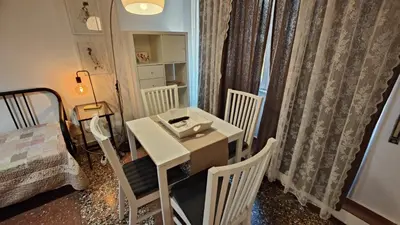 a small room with a white table and chairs at AL171 Tourist Rental close Metro B1 - Sant'Agnese Annibaliano in Rome