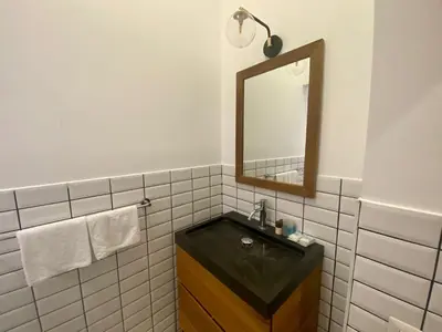 a bathroom with a black sink and a mirror at Prestige Apartment Nazionale in Rome