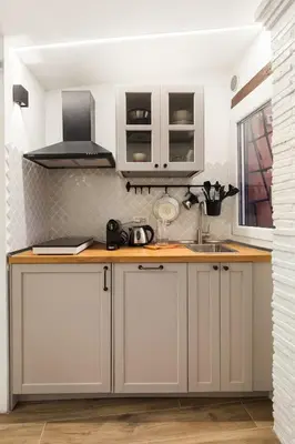 a kitchen with white cabinets and a sink at Pellegrino 113 in Rome