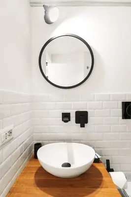 a bathroom with a large white sink and a mirror at Pellegrino 113 in Rome