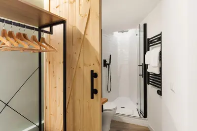 a bathroom with a toilet and a glass shower at Pellegrino 113 in Rome