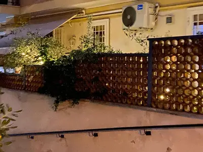 a fence with plants on top of a balcony at Casa Villa Pamphili in Rome