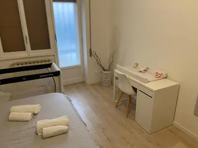 a small room with a bed and a sink and a table at Casa Villa Pamphili in Rome