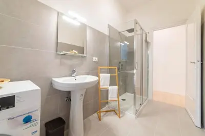 a bathroom with a sink and a shower at Casa Villa Pamphili in Rome
