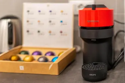 a black and red mixer next to a box of eggs at Casa Villa Pamphili in Rome
