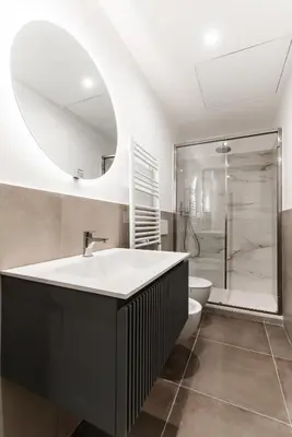 a bathroom with a tub and a toilet and a mirror at Boutique Apartment 29 in Rome