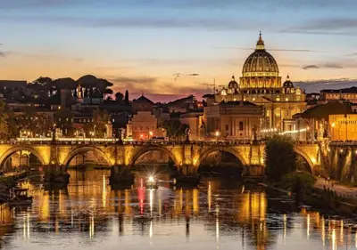 a view of a bridge over a river with a cathedral at [Trastevere - Rome] Strategic and Comfortable Loft in Rome