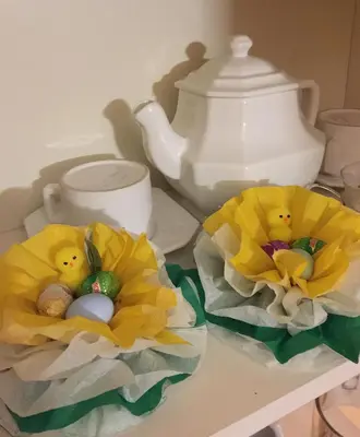 two eggs in yellow paper towels on a table at B&B Eternal Rome Inn in Rome