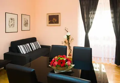 a living room with a table and a couch at B&B Eternal Rome Inn in Rome