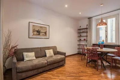 a living room with a couch and a table at The Best Rent - Three-Bedroom apartment near Villa Borghese in Rome