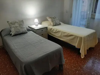 two beds sitting next to each other in a room at CorneliaGuestHouse in Rome
