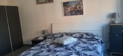 a bedroom with a bed with a pillow on it at CorneliaGuestHouse in Rome