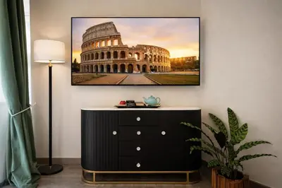 a picture of the colosseum in front of a building at RomAntic Dreams Sistina Guest House in Rome