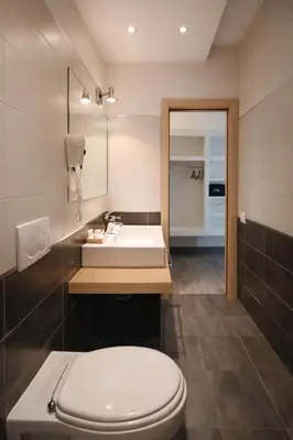a bathroom with a toilet and a sink at RomAntic Dreams Sistina Guest House in Rome