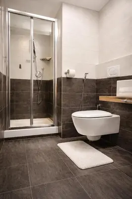 a bathroom with a shower and a toilet and a sink at RomAntic Dreams Sistina Guest House in Rome