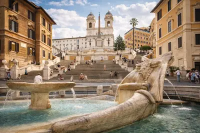 a fountain in the middle of a city with buildings at RomAntic Dreams Sistina Guest House in Rome