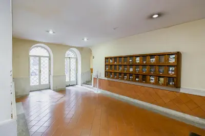 a large room with two windows and a tile floor at Barberini Exclusive Loft in Rome