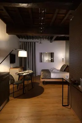 a bedroom with a bed and a television in a room at Casa Orchidea in Rome