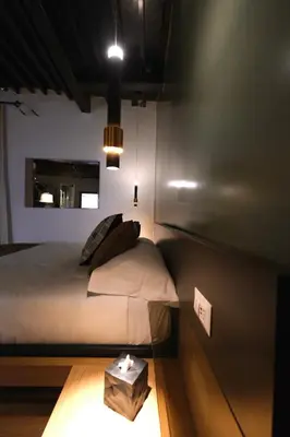 a bedroom with a bed with a box on the floor at Casa Orchidea in Rome