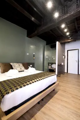 a bedroom with a large bed in a room at Casa Orchidea in Rome