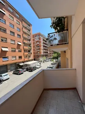 a balcony with a view of a parking lot at Appartamento Millelire in Rome