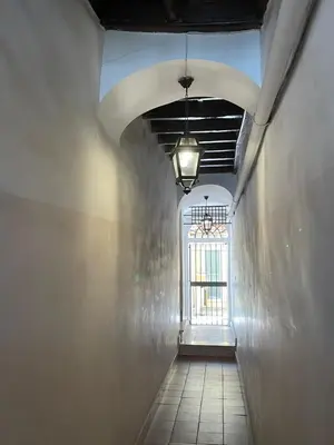 a hallway with a window in a building with a ceiling at Casa Lovera in Vaticano in Rome