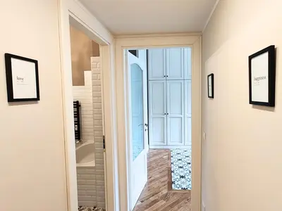 a hallway with a door leading to a bathroom at Luxury Apartment by Palazzo Senesi in Rome