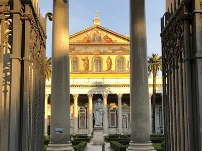 a large building with a statue in front of it at Luxury Apartment by Palazzo Senesi in Rome