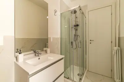 a bathroom with a sink and a shower at GuestHost - Functional Apartment Piazza Re di Roma in Rome