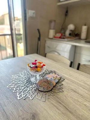 a glass bowl of fruit on a table at Appia Suite in Rome
