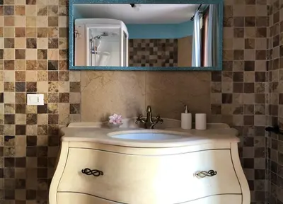 a bathroom with a sink and a mirror at Termini GHome in Rome