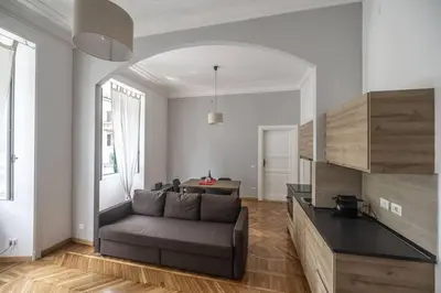 a living room with a couch and a table at Lovely and new apartment near Termini Station in Rome