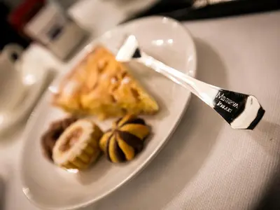 a plate of food on a table with a fork at Minerva Relais in Rome