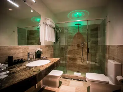 a bathroom with a sink and a shower and a toilet at Minerva Relais in Rome