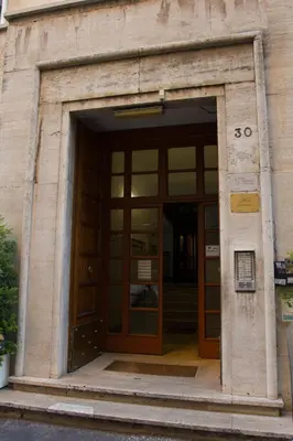 an entrance to a building with a revolving door at Windows on Rome in Rome
