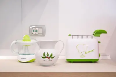 three kitchen appliances sitting on a kitchen counter at Casa Bouganville - St. Peter Romantic Apartment in Rome