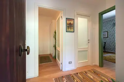a hallway with a door leading to a room at Casa Bouganville - St. Peter Romantic Apartment in Rome